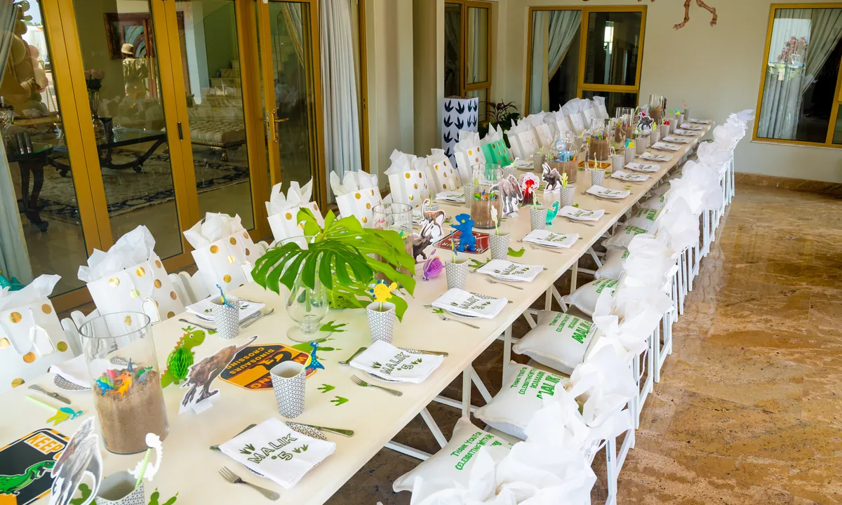 Playful dinosaur table setting for Malik's fifth birthday