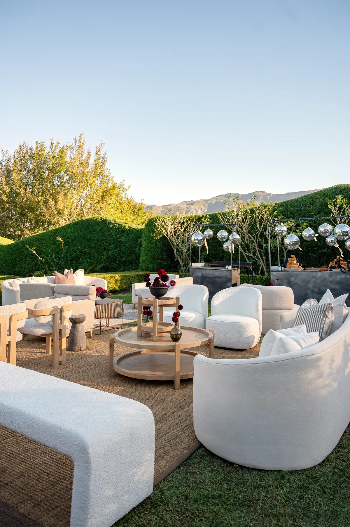 Curved white lounge seating in the garden