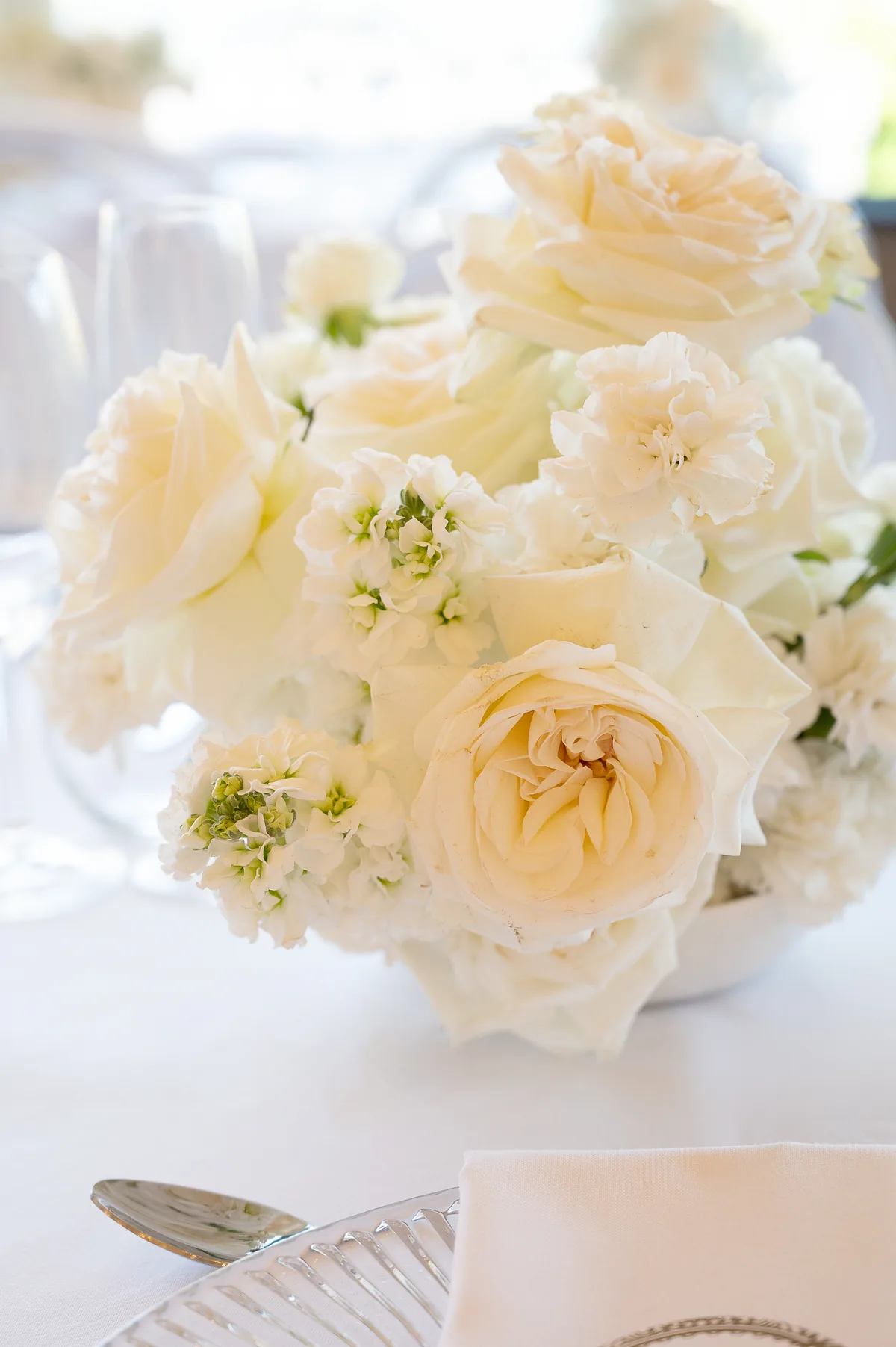 Soft white floral place setting detail