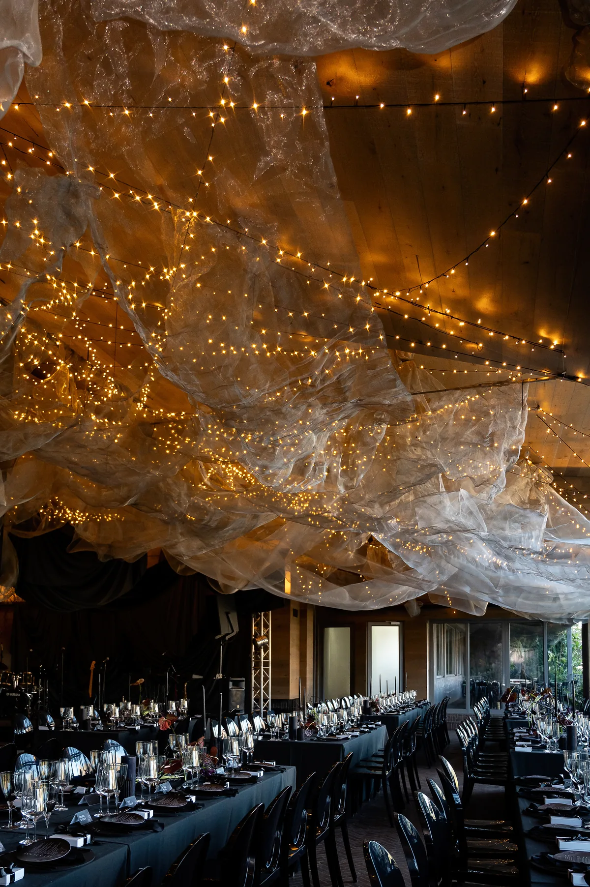 Evening reception beneath a canopy of lights