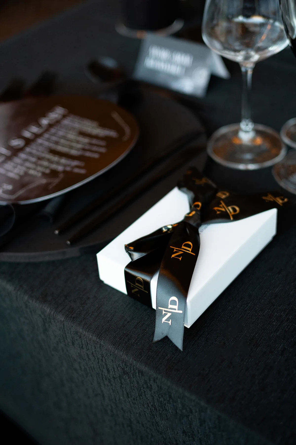 Black place setting with a personalised menu
