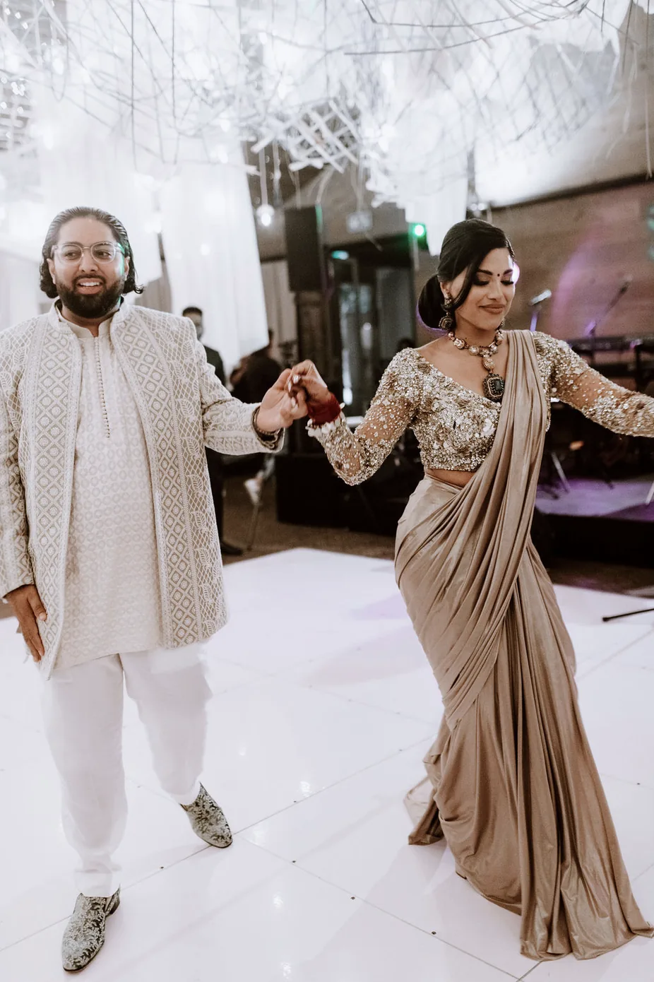 The couple dancing together at their reception