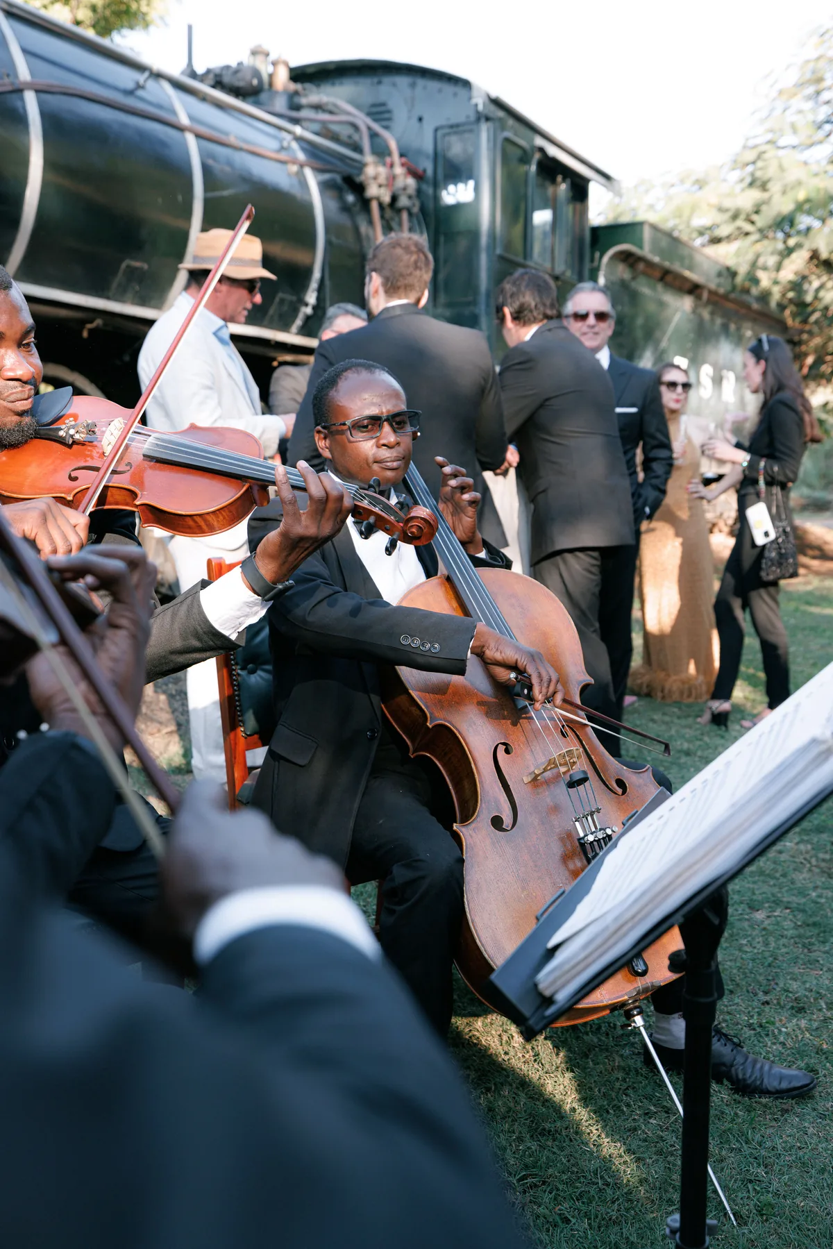 Live musicians performing beside the train