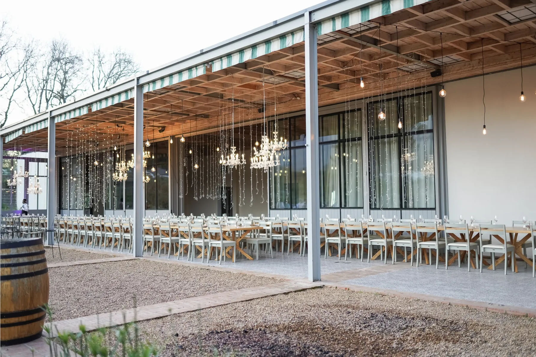 Long reception tables arranged beneath the veranda